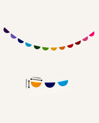 Paper Party Studio rainbow birthday decoration set with fan backdrop, banner and tassel garland.