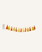 Paper Party Studio tissue paper tassel garland in vibrant colours, ready to hang for party decor.