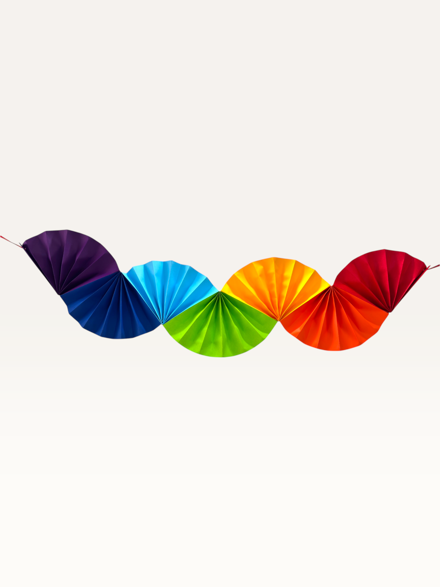Paper Party Studio Colorwave paper fan garland, a handmade cardstock wall hanging for parties.