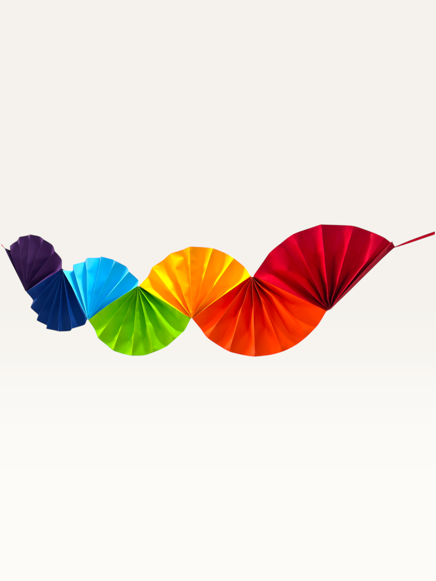 Paper Party Studio handmade Colorwave paper fan garland, ready to hang for party decor.