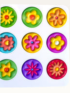 Paper Party Studio 3D flower sticker sheet with fifteen colorful, puffy, glossy kiss-cut floral designs for crafts.