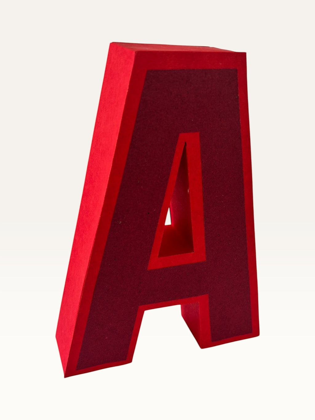 Handcrafted Paper Party Studio 3D letter A in red layered cardstock for birthday decor and event styling.