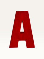 Paper Party Studio handcrafted red 3D letter A made from layered cardstock for party decor and shelf styling.