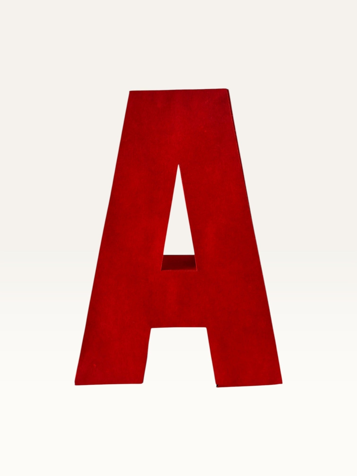 Paper Party Studio handcrafted red 3D letter A made from layered cardstock for party decor and shelf styling.