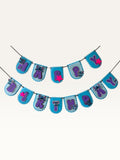 Paper Party Studio blue scalloped Happy Birthday banner with purple letters, alien characters, and pink star accents.