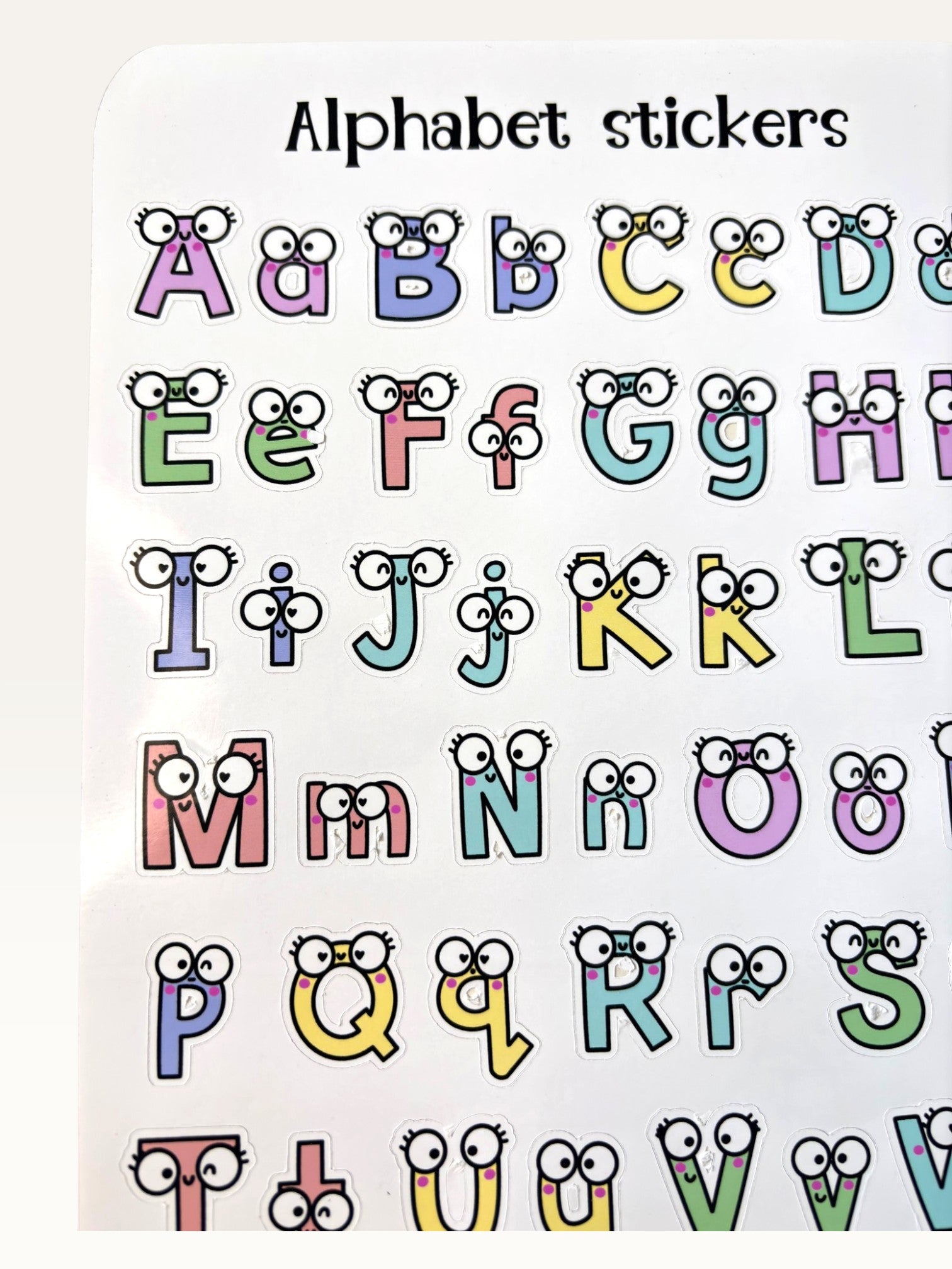 Paper Party Studio alphabet sticker sheet with colourful uppercase and lowercase letters featuring cute googly eyes.