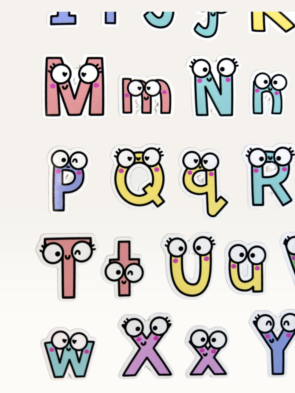 Paper Party Studio alphabet sticker sheet with colourful glossy letters featuring cute googly eyes and expressions.