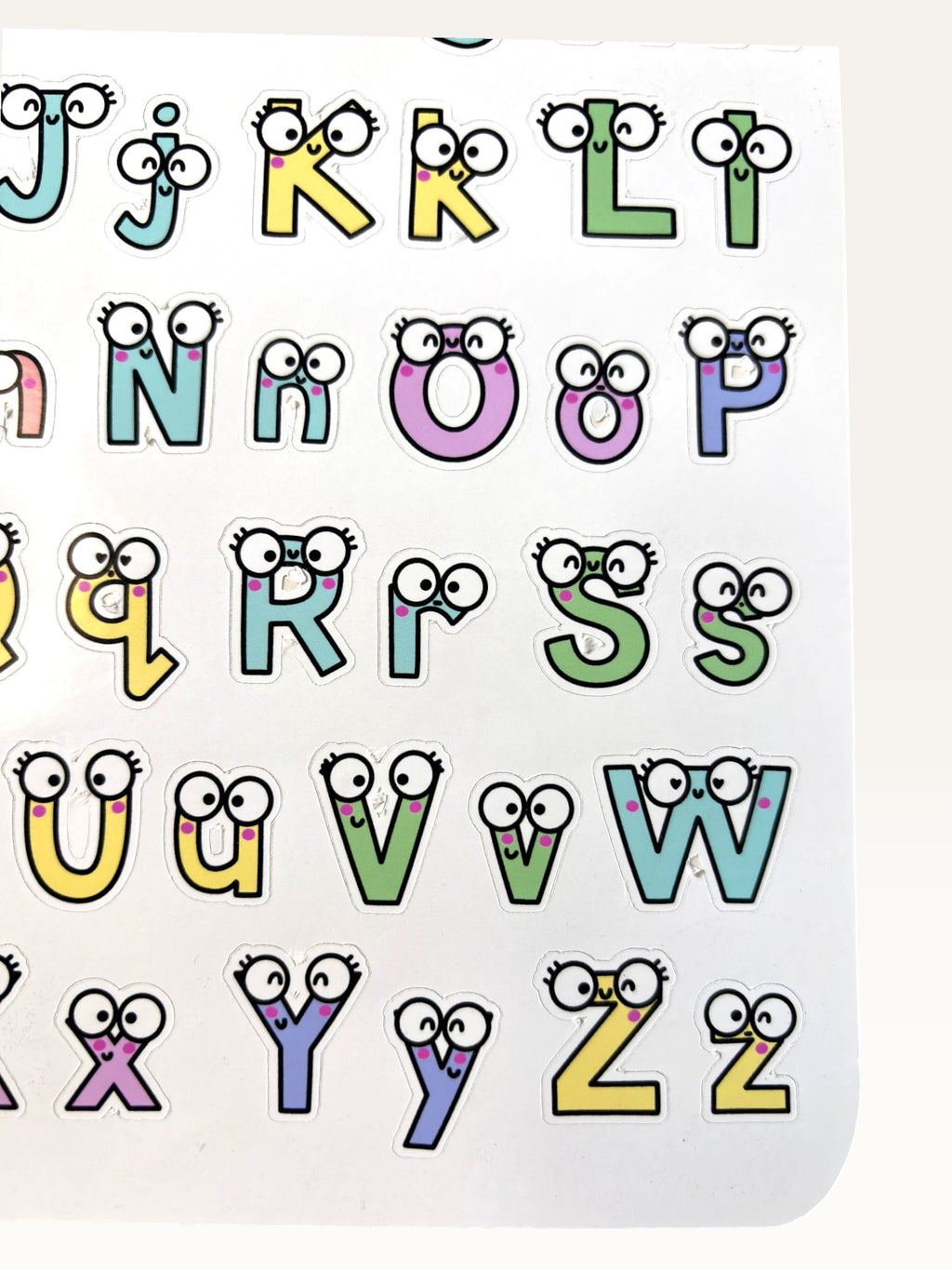 Paper Party Studio alphabet sticker sheet featuring colourful letters with cute googly eyes and glossy finish.