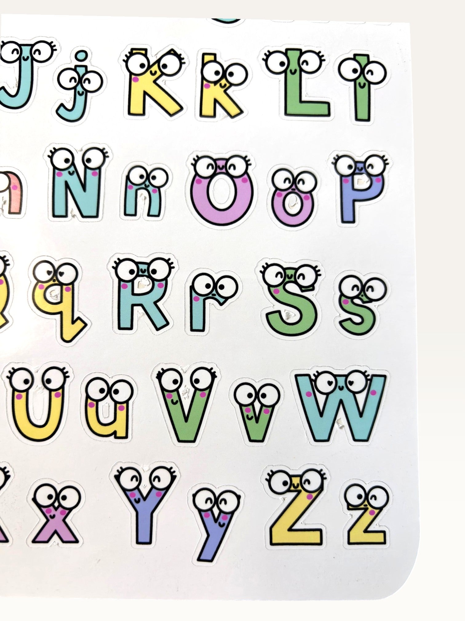 Paper Party Studio alphabet sticker sheet featuring colourful letters with cute googly eyes and glossy finish.