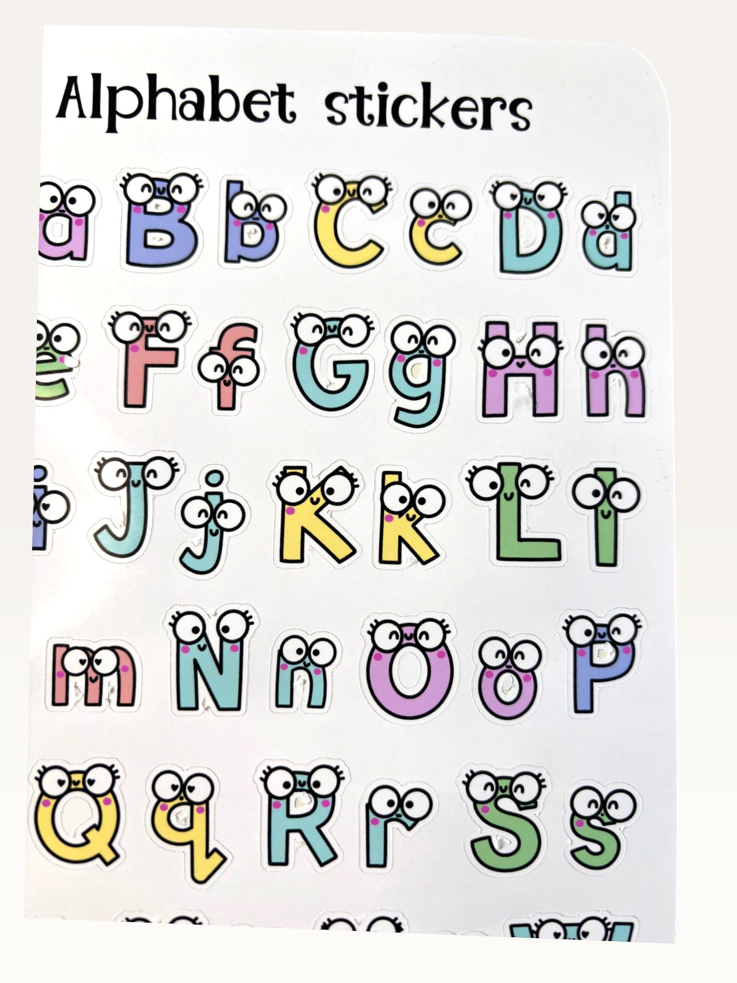 Paper Party Studio alphabet sticker sheet with colourful uppercase and lowercase letters featuring cute googly eyes.