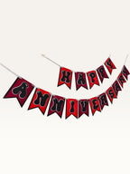 Paper Party Studio Happy Anniversary banner with red swallowtail flags and black bubble letters on silver string.