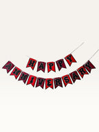 Paper Party Studio Happy Anniversary bunting with black bubble letters on red swallowtail cardstock flags.