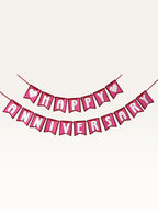 Paper Party Studio pink and white Happy Anniversary swallowtail paper bunting banner with heart accents.