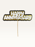 Paper Party Studio Happy Anniversary cake topper with layered white, gold, and black cardstock and heart cut-outs.