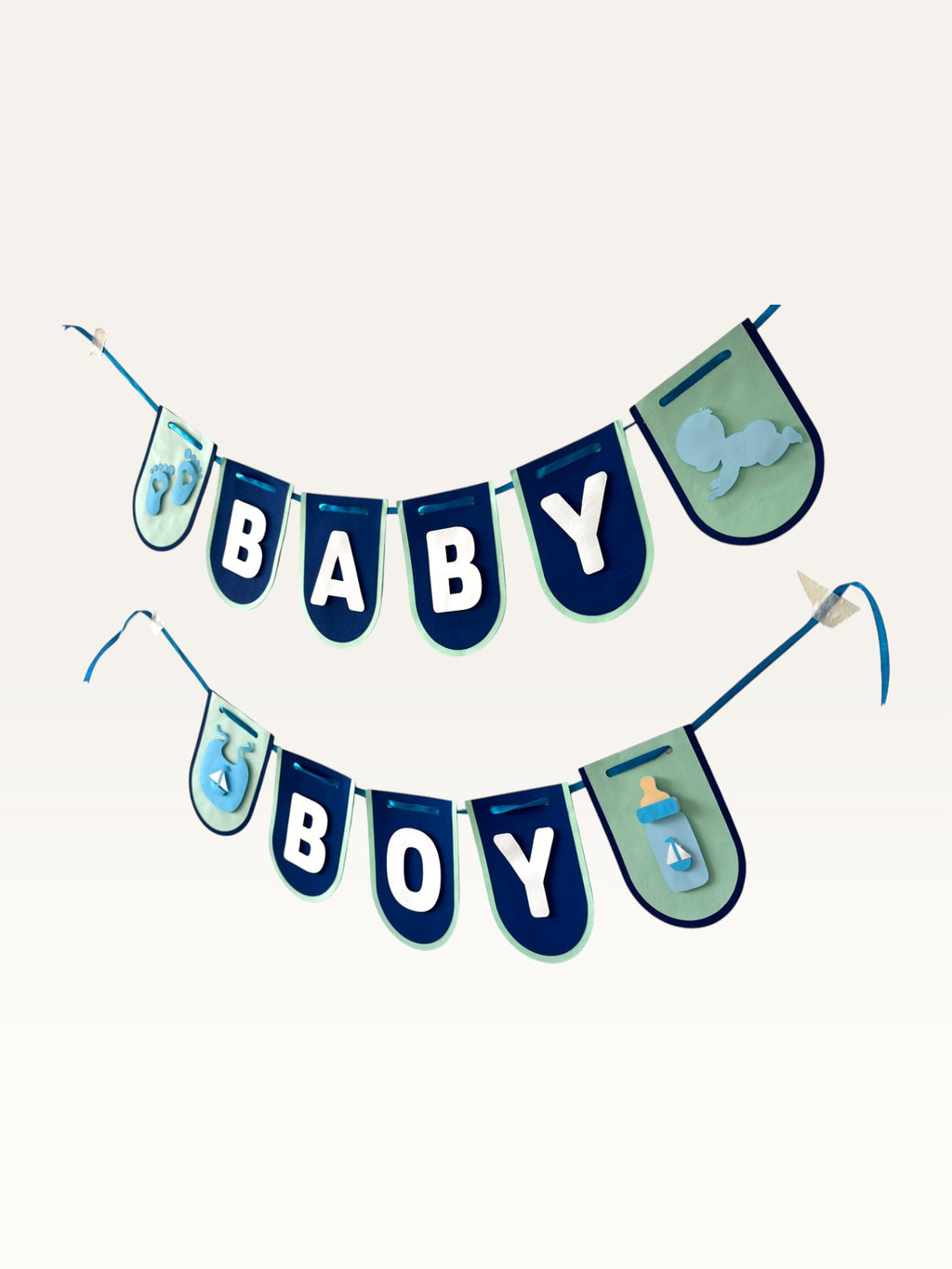 Paper Party Studio navy and sage Baby Boy banner with white lettering and cute baby-themed cut-outs on a cord.