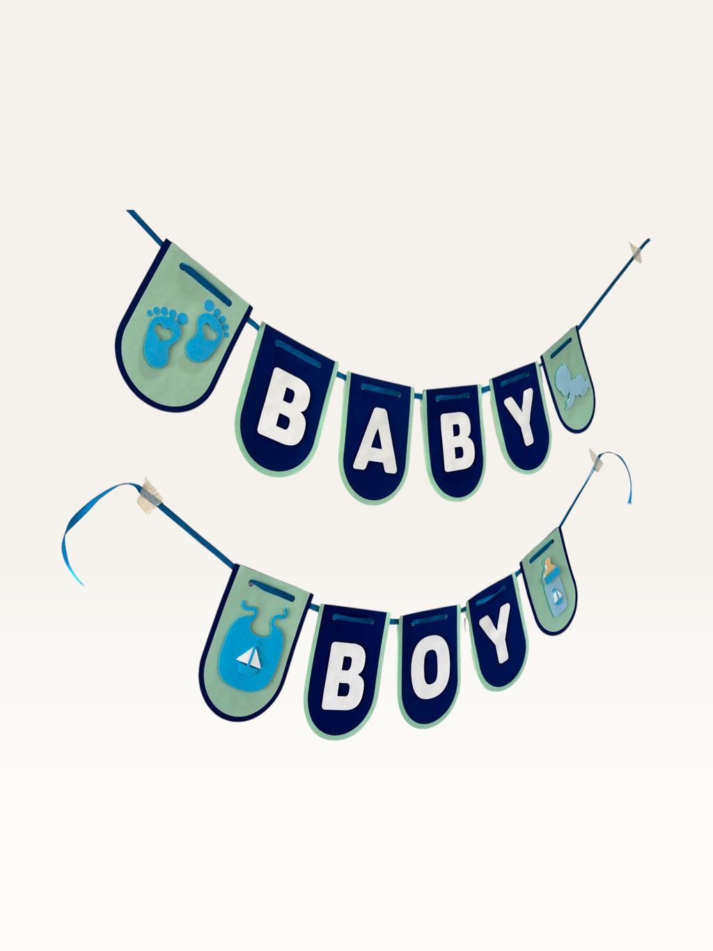 Paper Party Studio navy and sage Baby Boy cardstock banner with baby-themed cut-outs for baby shower decorations.