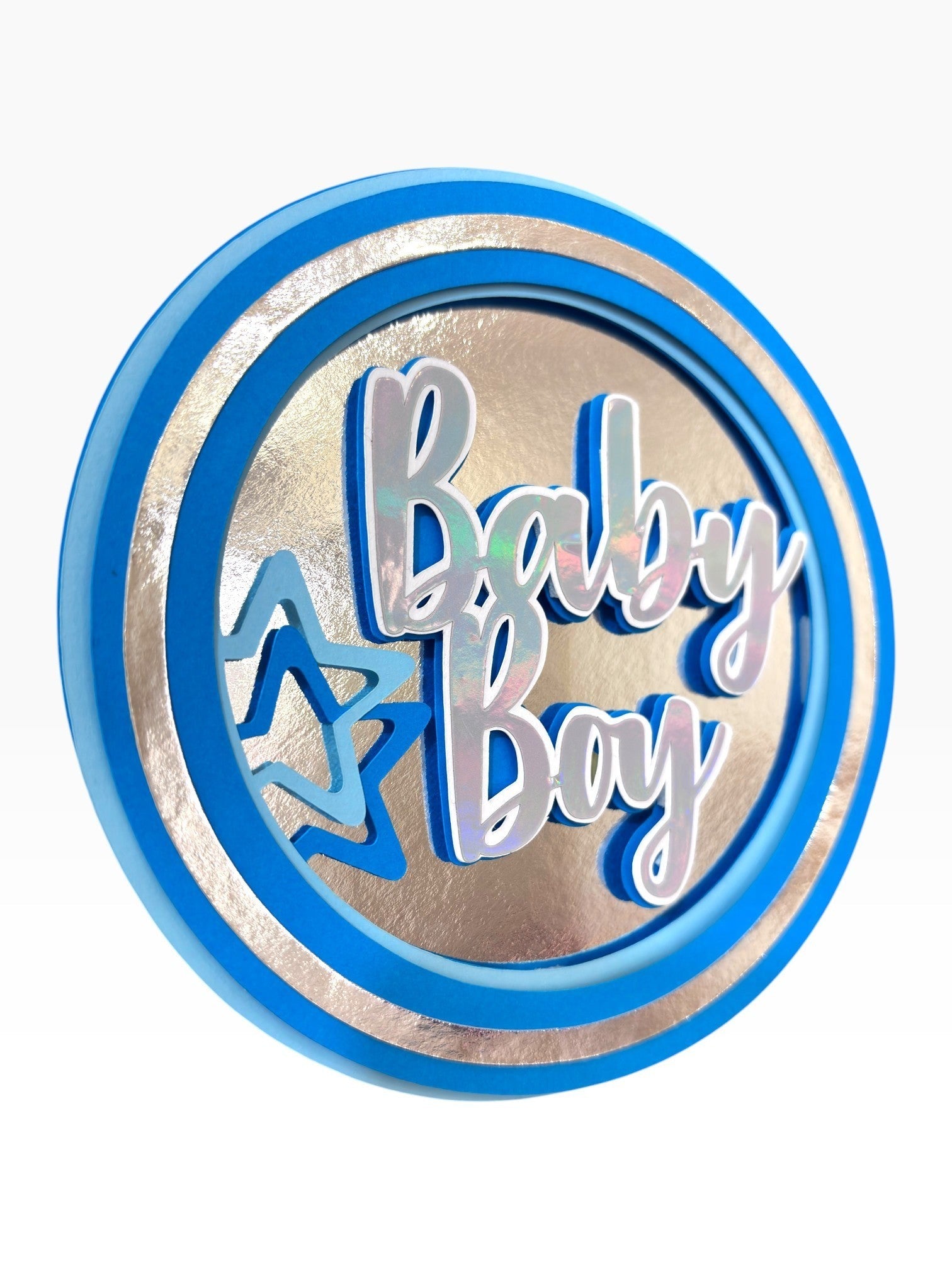 Paper Party Studio blue and silver holographic "Baby Boy" cake topper with layered stars.
