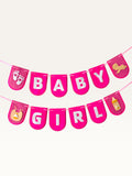 Paper Party Studio Baby Girl banner with hot-pink cardstock flags, white lettering, and cute baby-themed motifs.