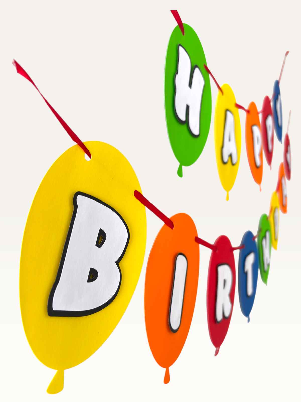 Paper Party Studio multicoloured balloon-shaped Happy Birthday banner with dimensional white letters on red string.