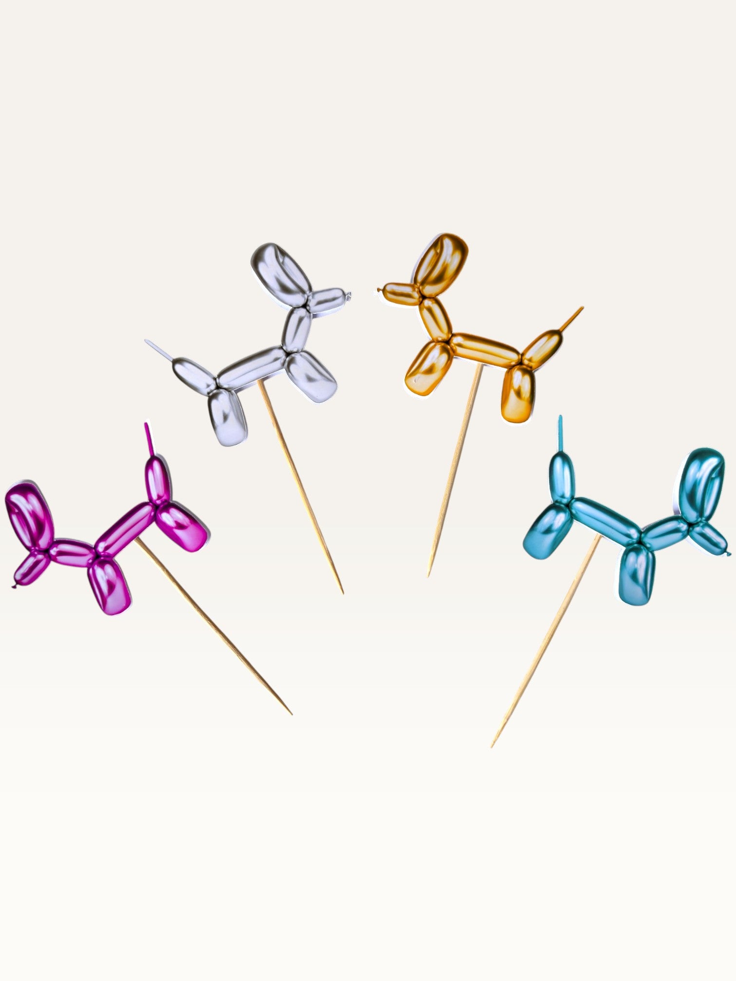 Paper Party Studio metallic balloon dog cupcake toppers in pink, silver, gold, and blue on bamboo sticks.