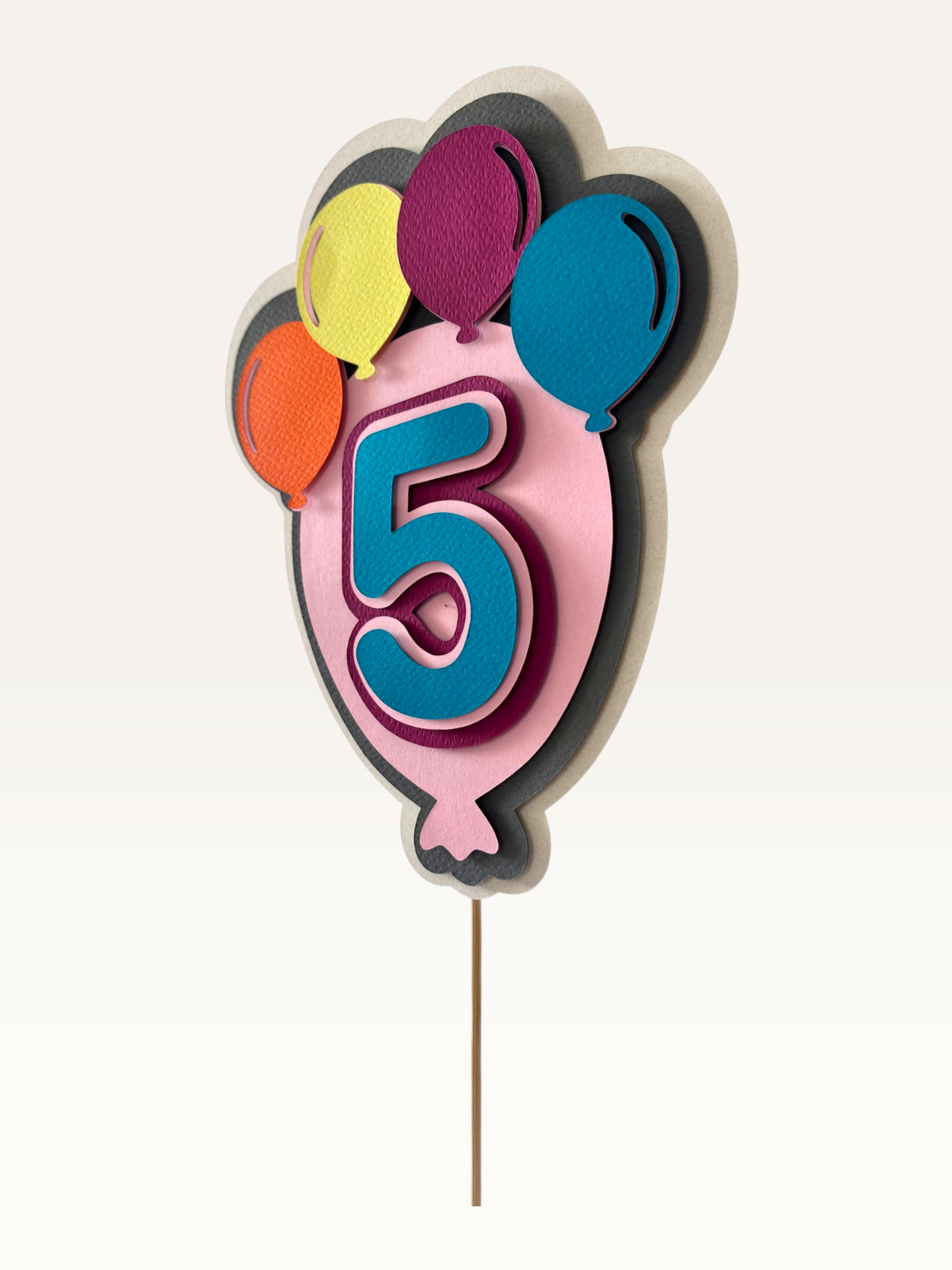 Paper Party Studio balloon number cake topper in colourful layered cardstock for birthday celebrations