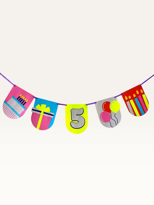Paper Party Studio custom birthday bunting with colorful cardstock flags featuring cake, gift, balloons, and number 5.