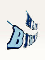 Paper Party Studio blue layered paper Happy Birthday banner with dimensional cut-out letters on a hanging cord