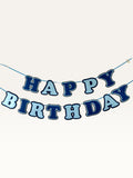 Paper Party Studio navy and sky blue layered paper Happy Birthday banner strung on a cord for party decoration.