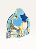 Paper Party Studio blue and gold Happy Birthday shaker cake topper with glitter, sequins, heart, and star accents.
