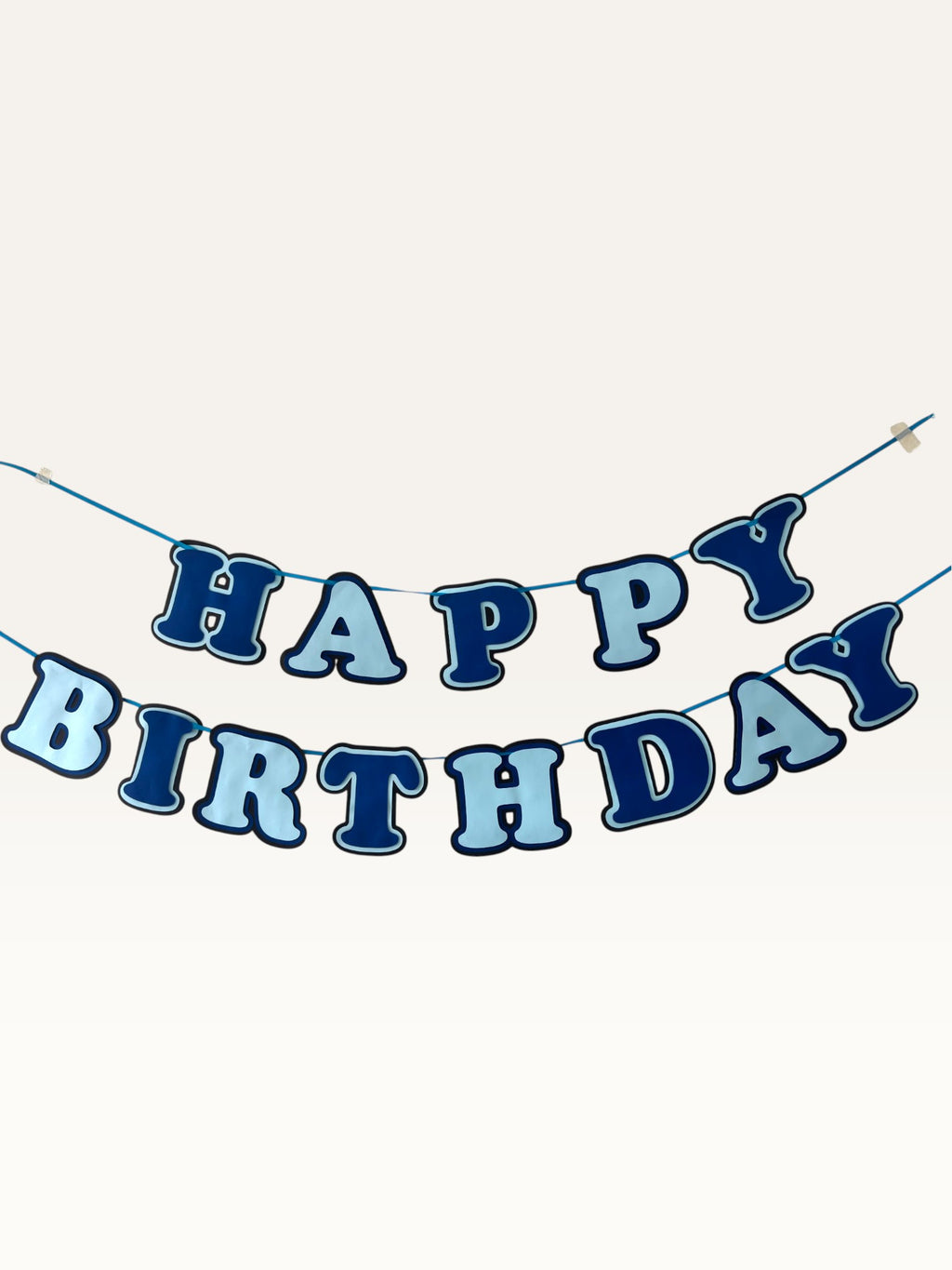 Paper Party Studio blue layered paper Happy Birthday banner with dimensional cut-out letters on a hanging cord
