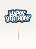 Paper Party Studio layered blue and white Happy Birthday cake topper with scalloped edges on a wooden pick.