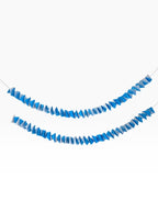 Paper Party Studio blue ombre accordion streamer garland made of folded cardstock.