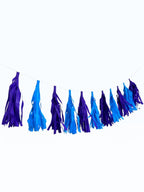 Paper Party Studio blue and purple tissue paper tassel garland for party decoration and event backdrops.