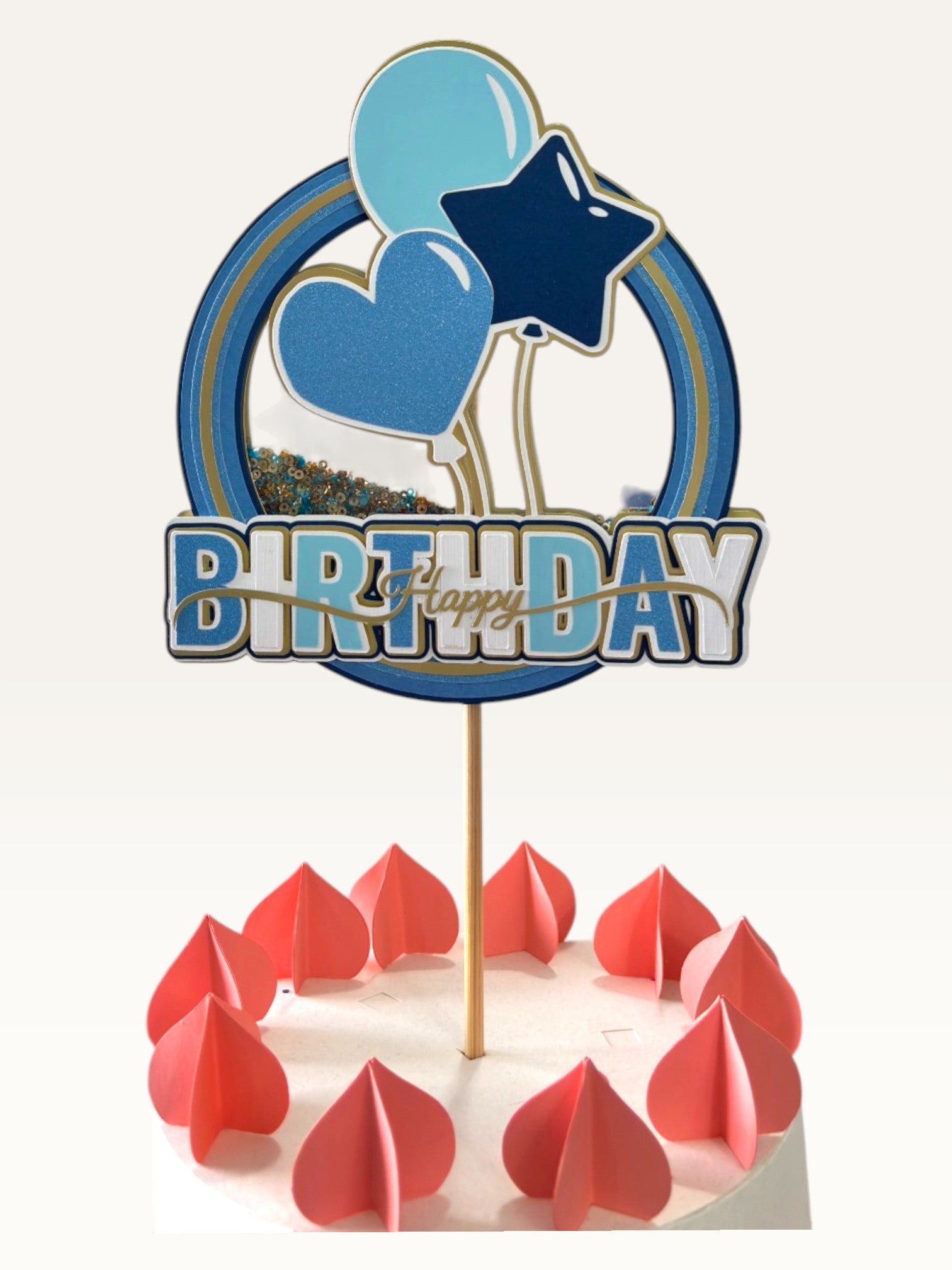Paper Party Studio blue and yellow birthday cake topper with heart and star balloons on a white cake