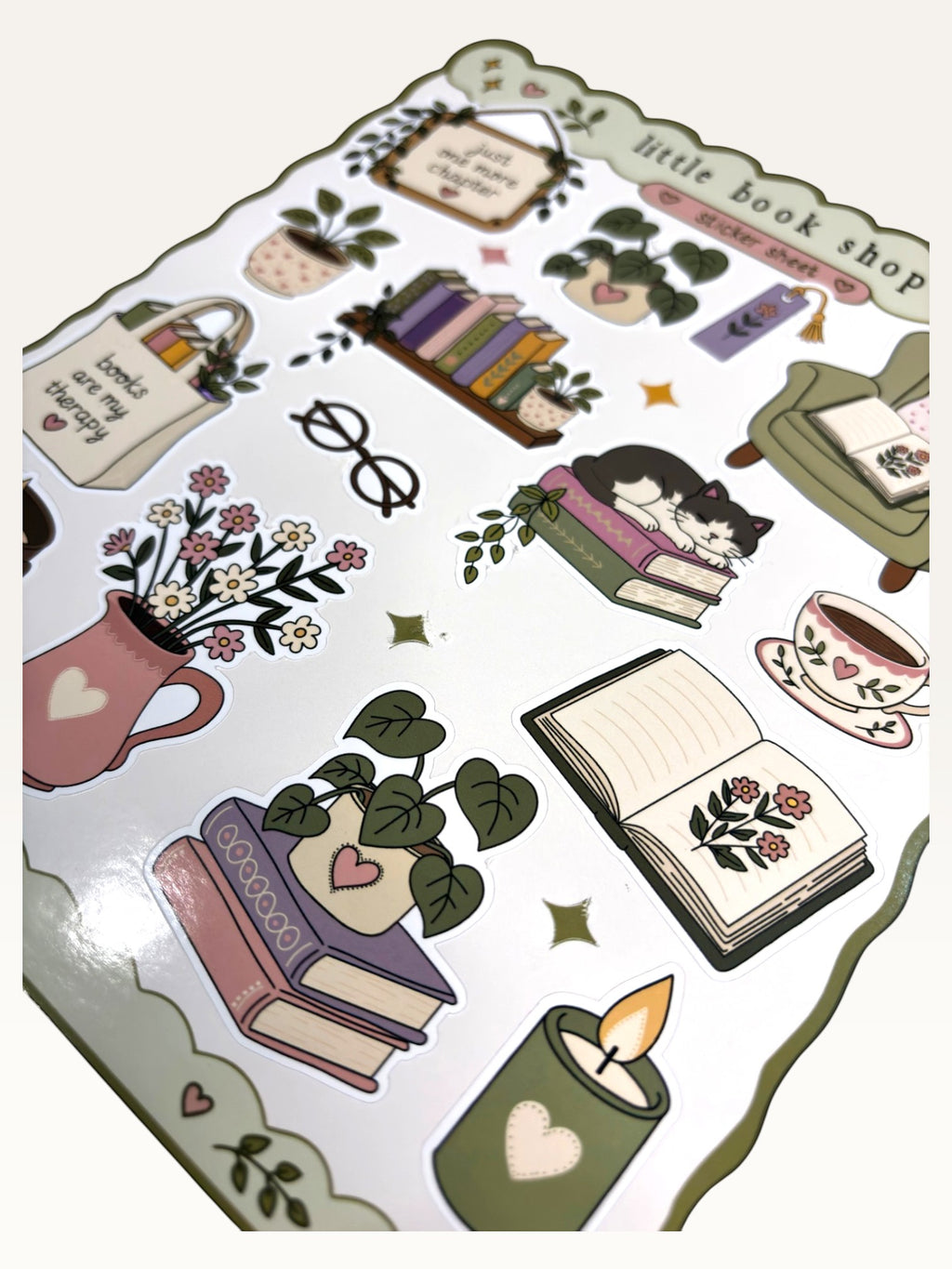 Paper Party Studio glossy sticker sheet featuring illustrated books, a cat, plants, and cozy reading-themed items.