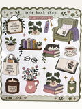 Paper Party Studio little book shop sticker sheet with illustrations of books, a cat, plants, and cozy reading items.