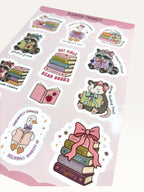Paper Party Studio Bookish Friends sticker sheet featuring illustrated raccoons, geese, and opossums reading books.