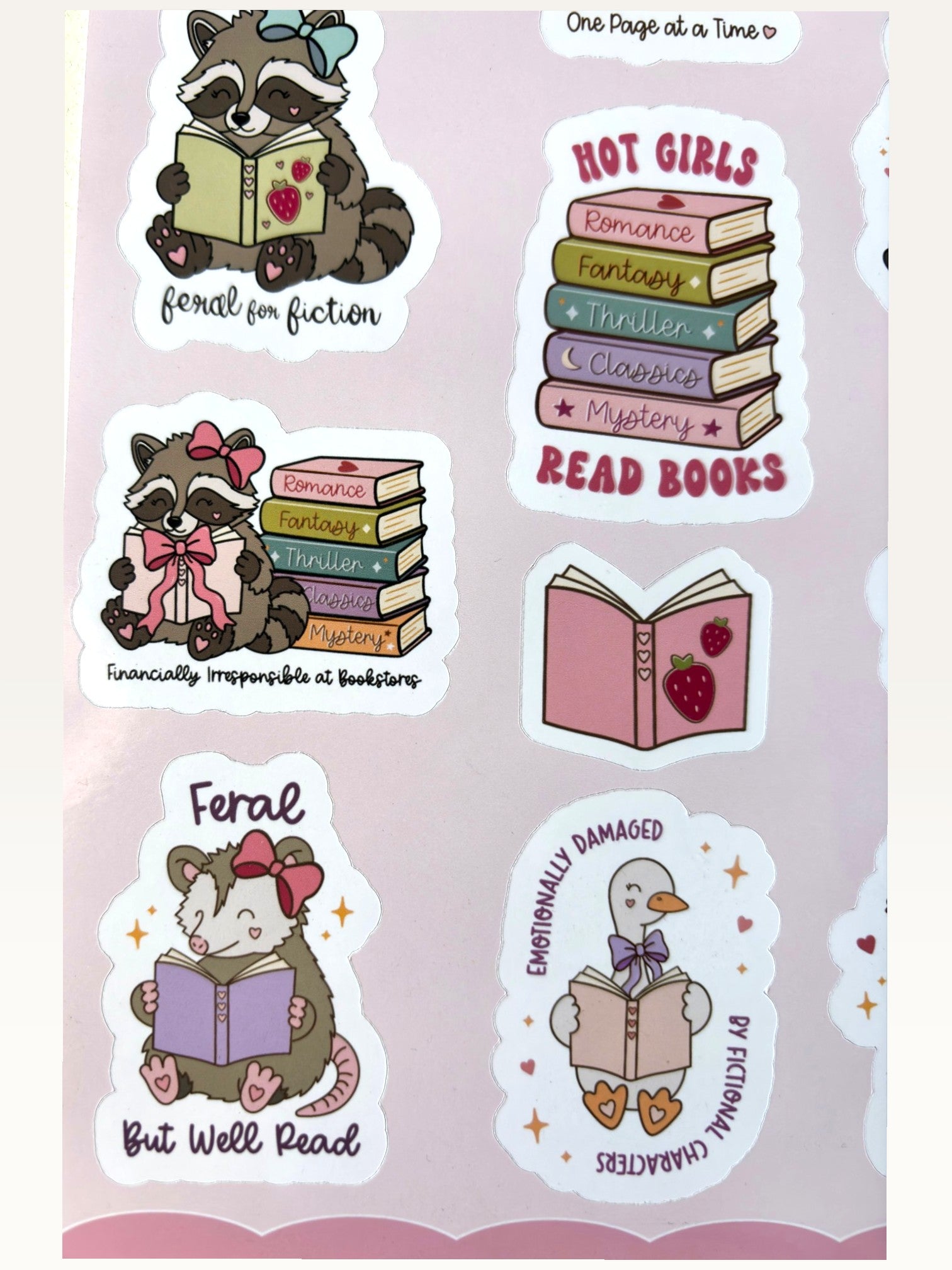 Paper Party Studio bookish sticker sheet featuring cute raccoons, geese, and opossums reading books on glossy paper.