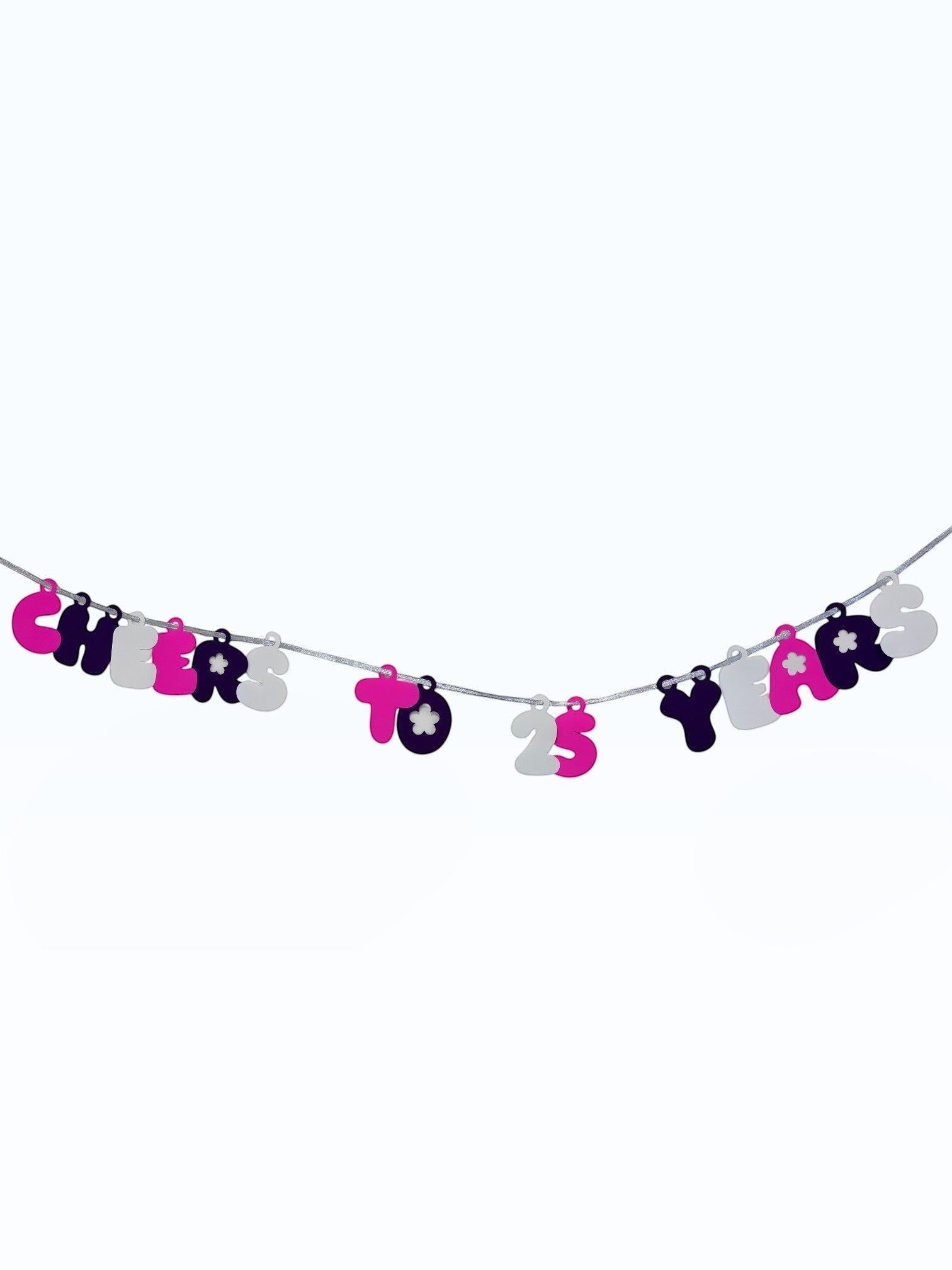 Paper Party Studio 'Cheers to 25 Years' bubble letter garland in pink, black, and white with daisy accents on a silver cord.