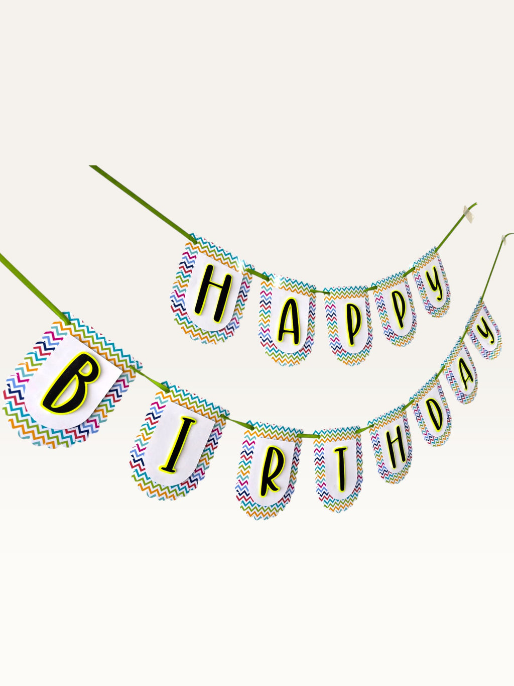 Paper Party Studio Happy Birthday banner with multicolour chevron border on white scalloped paper flags and green cord