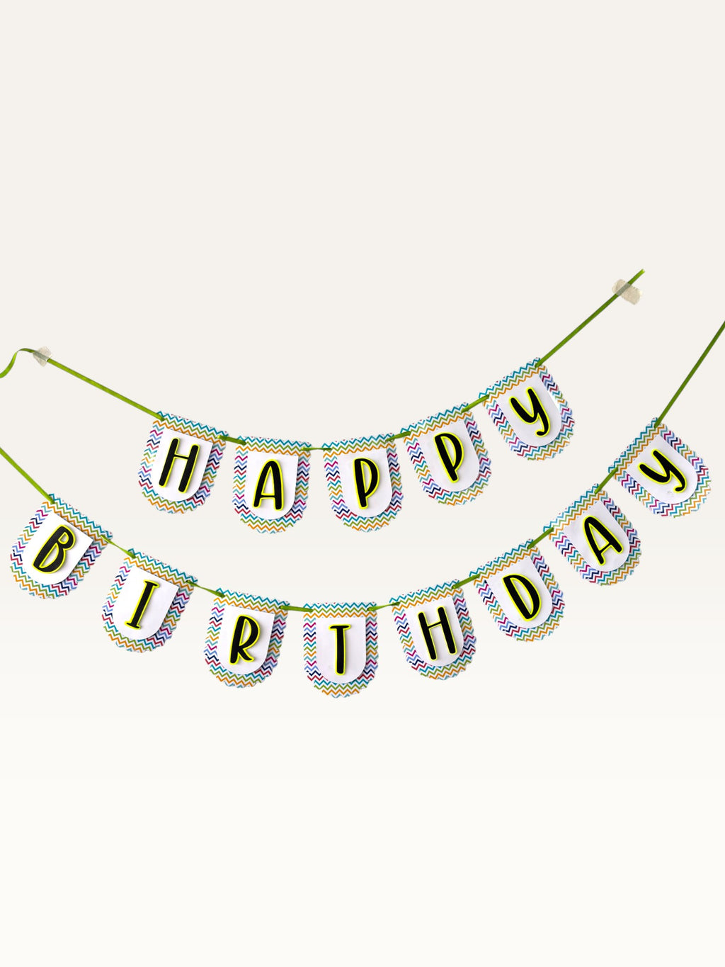 Paper Party Studio Happy Birthday banner with multicolour chevron border on white scalloped paper flags and green cord.