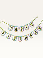 Paper Party Studio Happy Birthday banner with multicolour chevron border on white scalloped paper flags and green cord.
