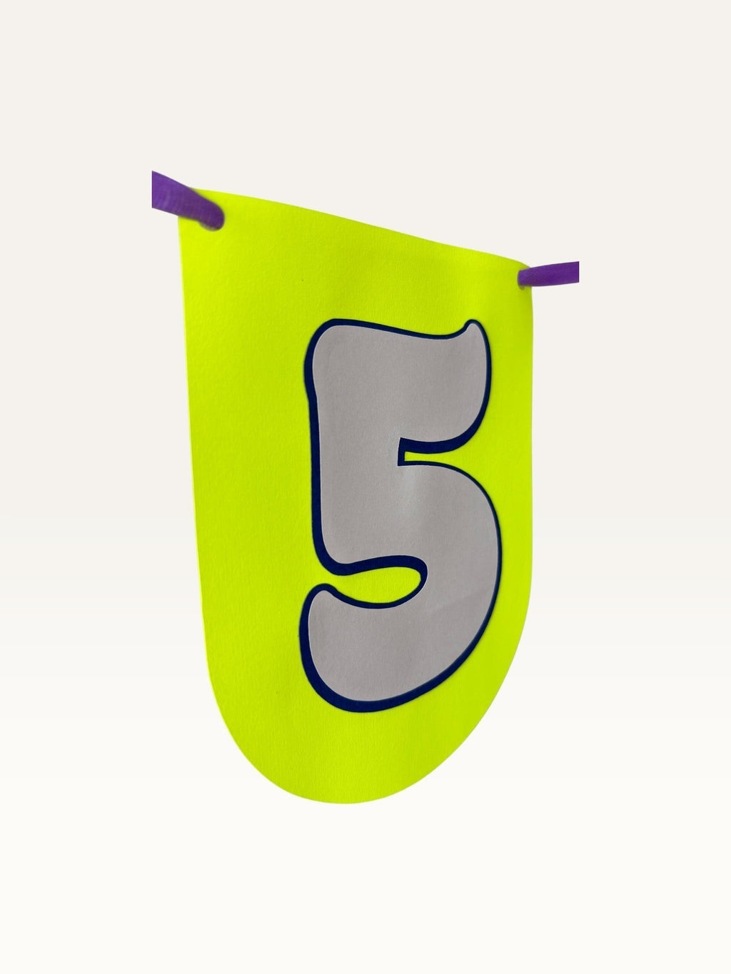 Paper Party Studio custom birthday bunting featuring a neon yellow U-shaped cardstock flag with a grey number five.