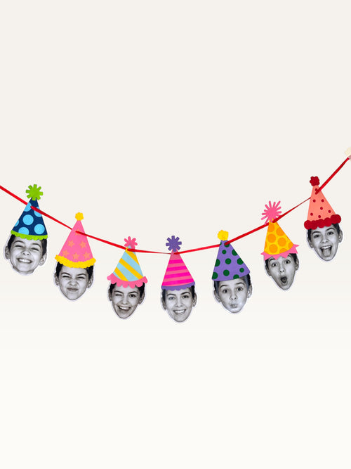 Paper Party Studio custom photo garland featuring black and white portrait cut-outs wearing colourful party hats.