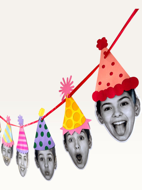Paper Party Studio custom photo garland featuring black and white portrait cut-outs wearing colourful party hats.