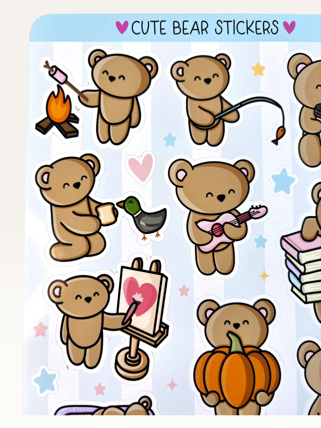 Paper Party Studio glossy sticker sheet featuring cute brown bears roasting marshmallows, playing guitar, and painting