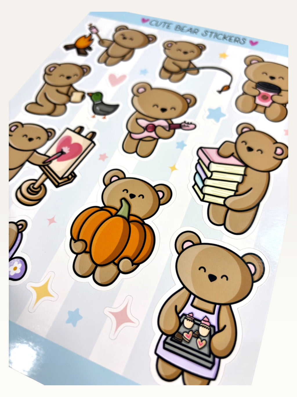 Paper Party Studio glossy sticker sheet featuring cute brown bears in various activities like painting and baking.