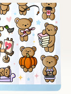 Paper Party Studio glossy sticker sheet featuring cute brown bears with pumpkins, guitars, and books on a blue background