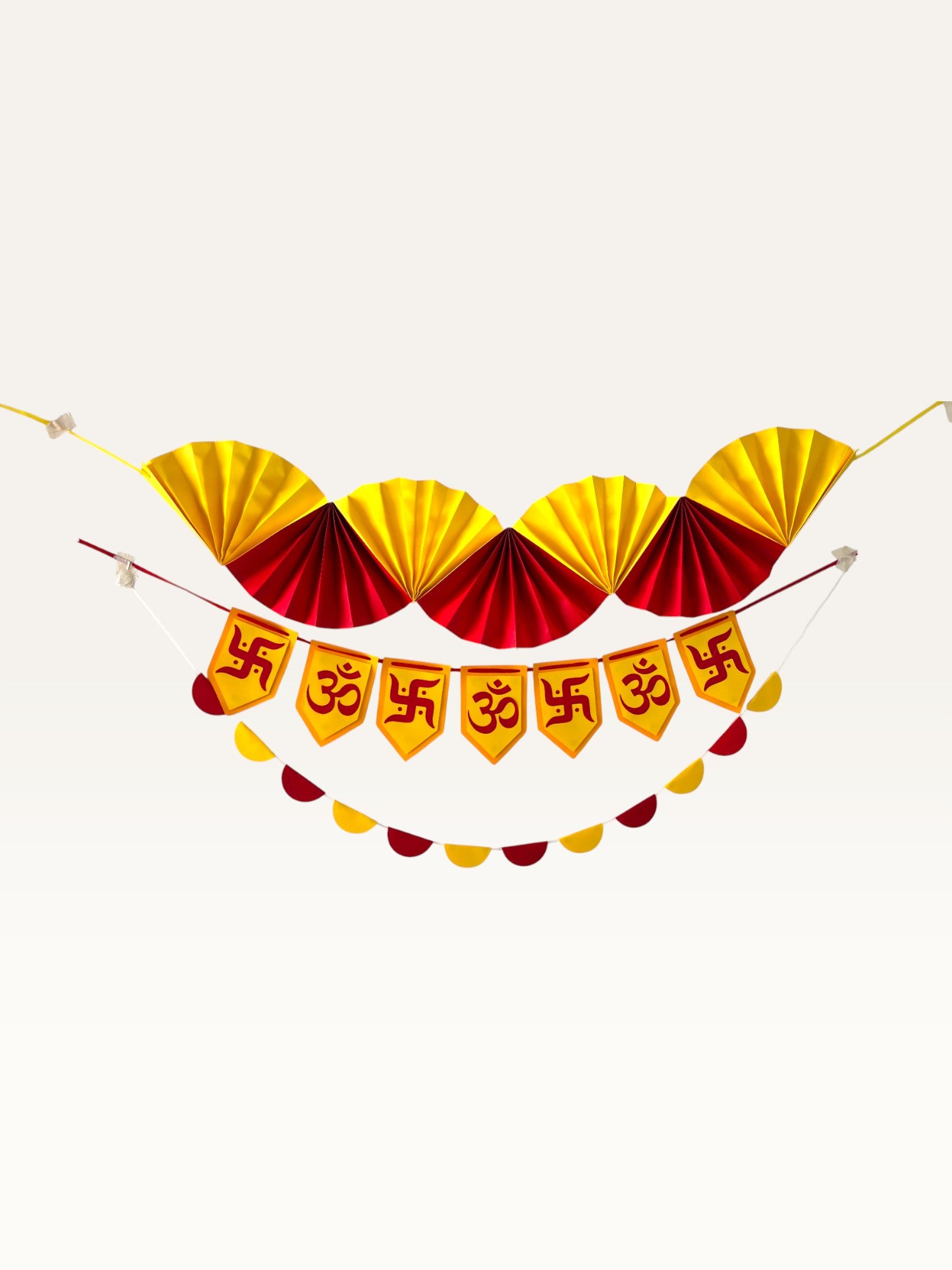 Paper Party Studio Diwali decoration set featuring yellow and red paper fans, Om and Swastik banner, and scallops.