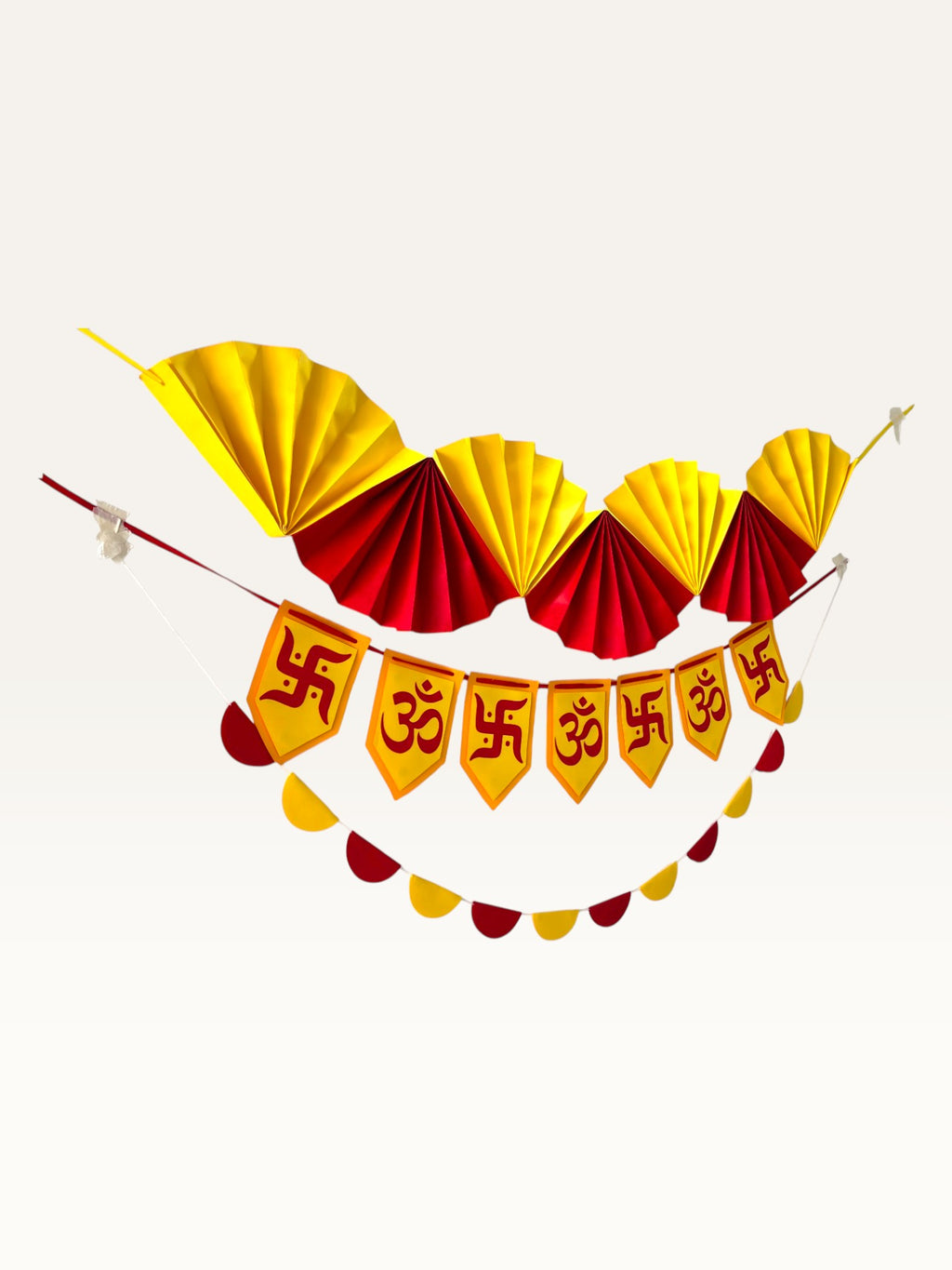 Paper Party Studio yellow and red paper Diwali decoration set featuring Om and Swastik motifs and fan garlands.